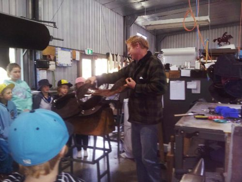 Kids Tour - Ben showing saddle making techniques